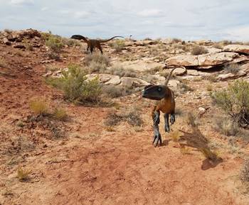 Two carnivorous dinosaurs looking for food on the Moab Giants dinosaur trail, Moab, UT.